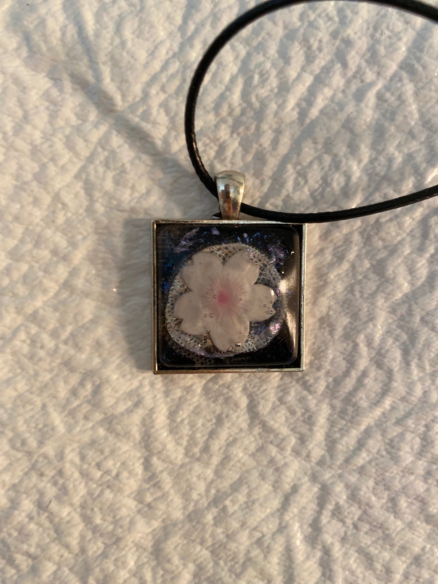 Flower necklace in a square bezel