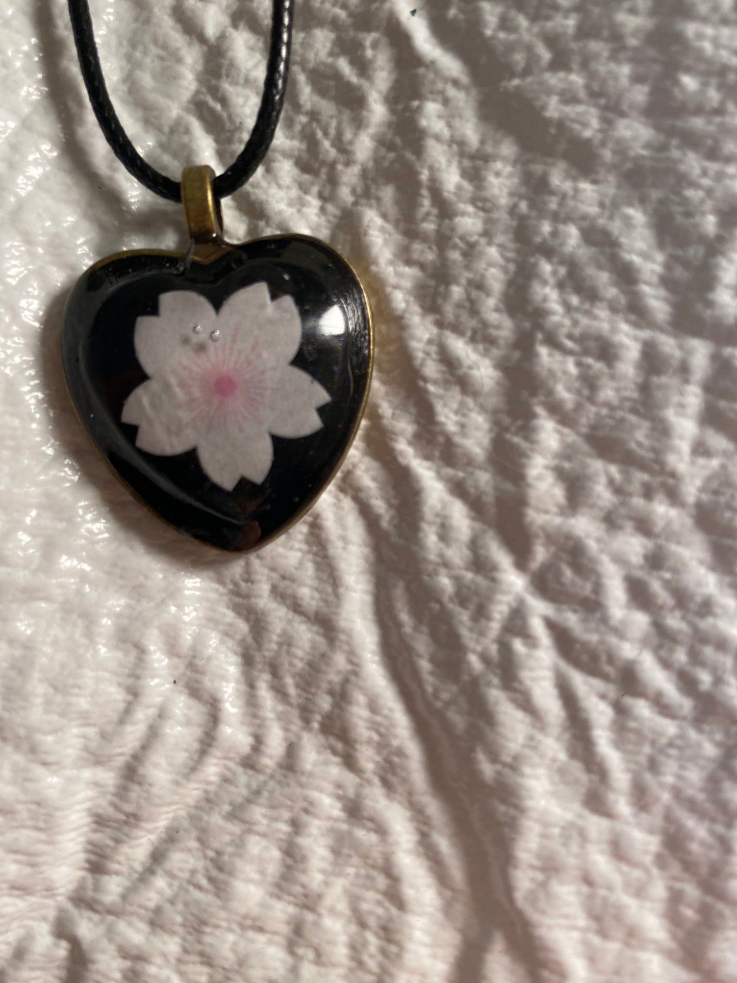 Flower in heart bezel pendant