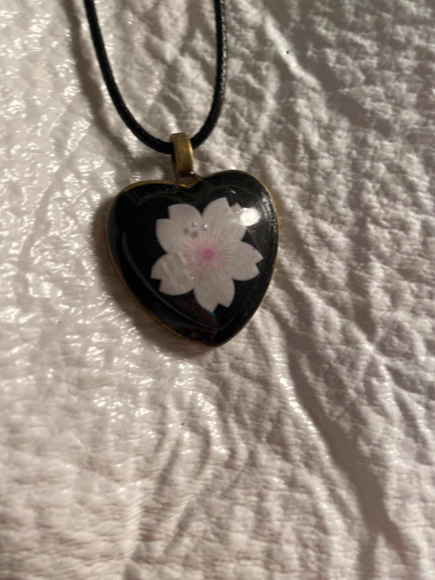 Flower in heart bezel pendant