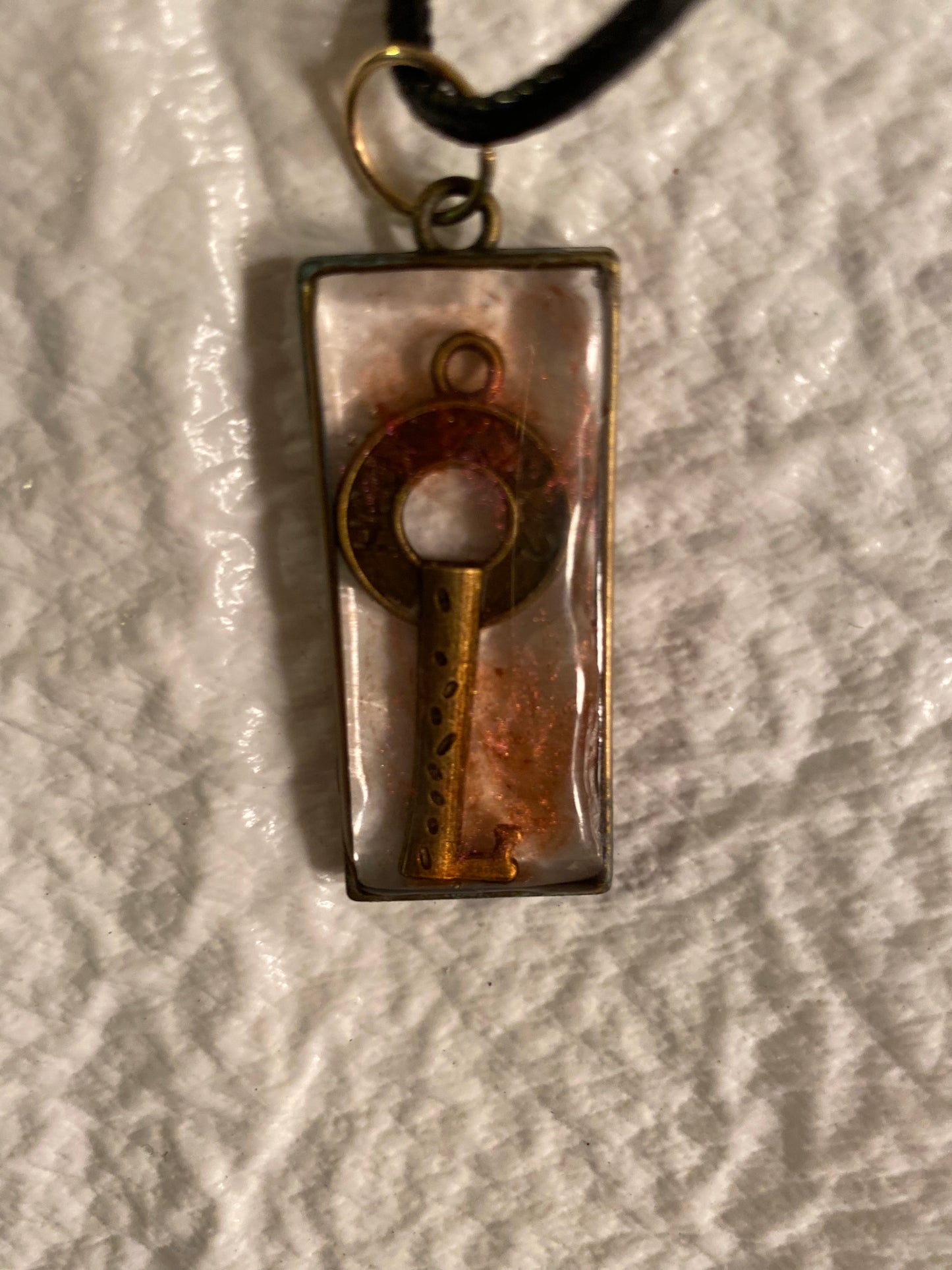 Key in rectangular bezel pendant