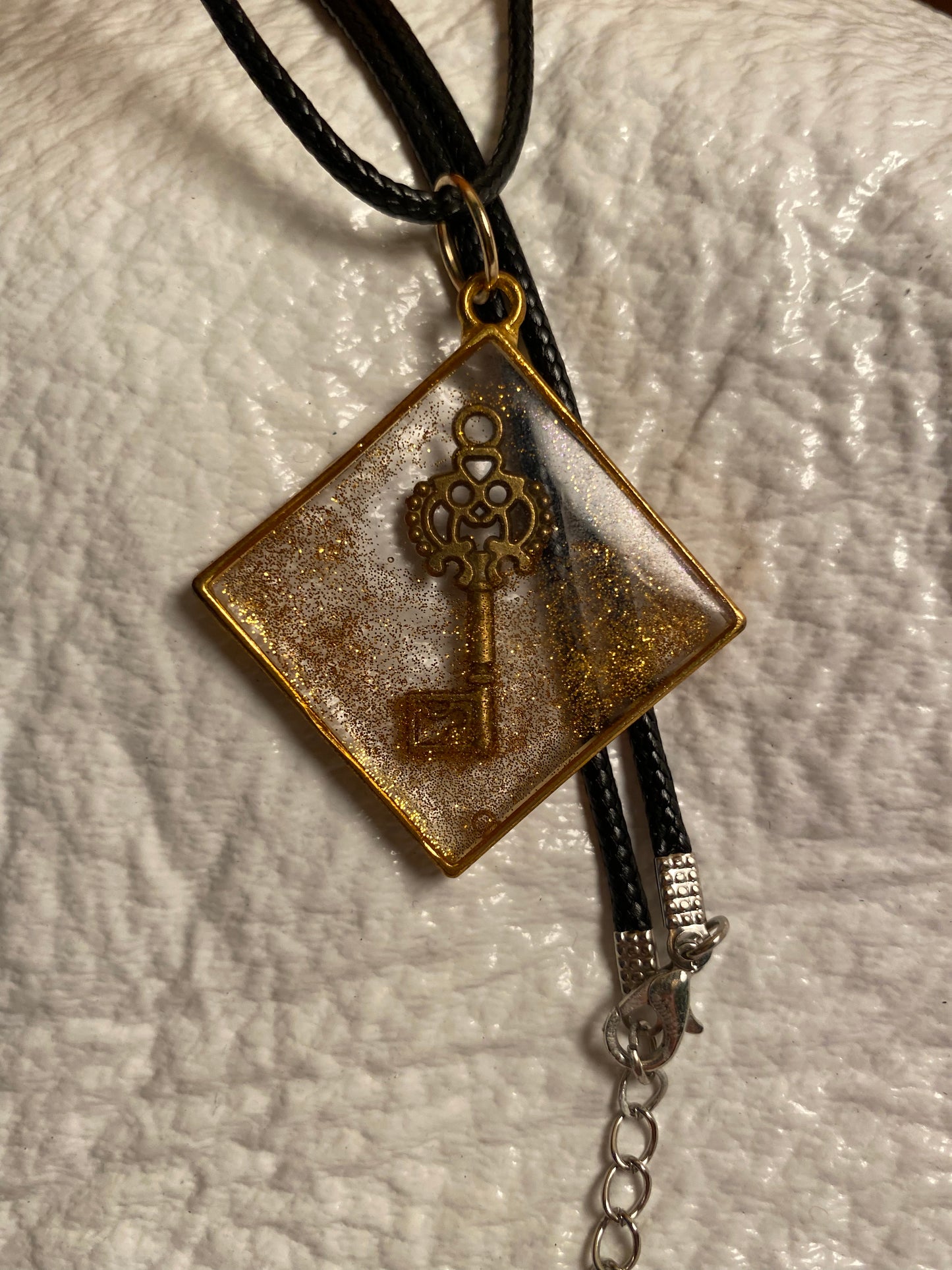 Key in a diamond with gold glitter