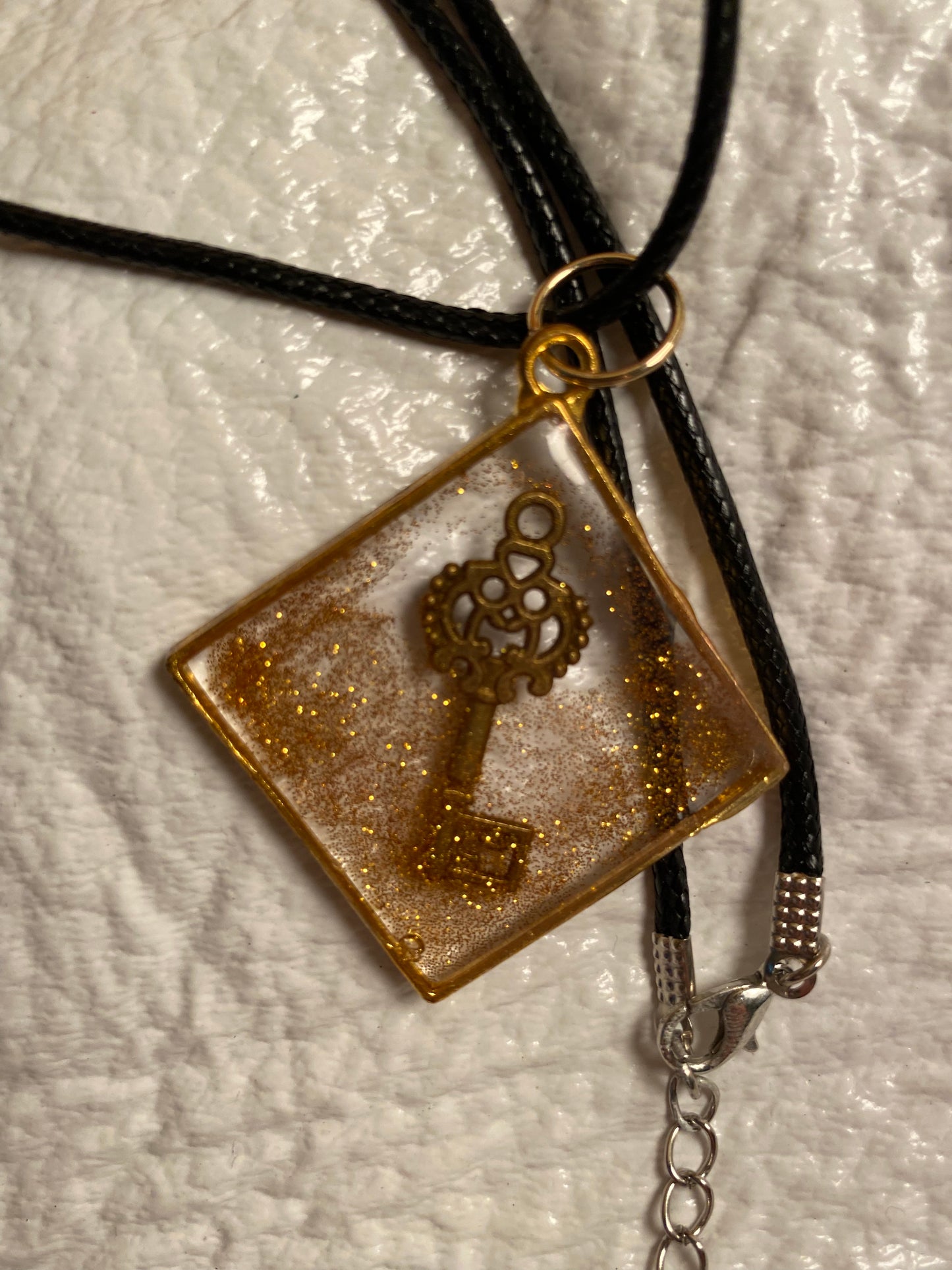 Key in a diamond with gold glitter