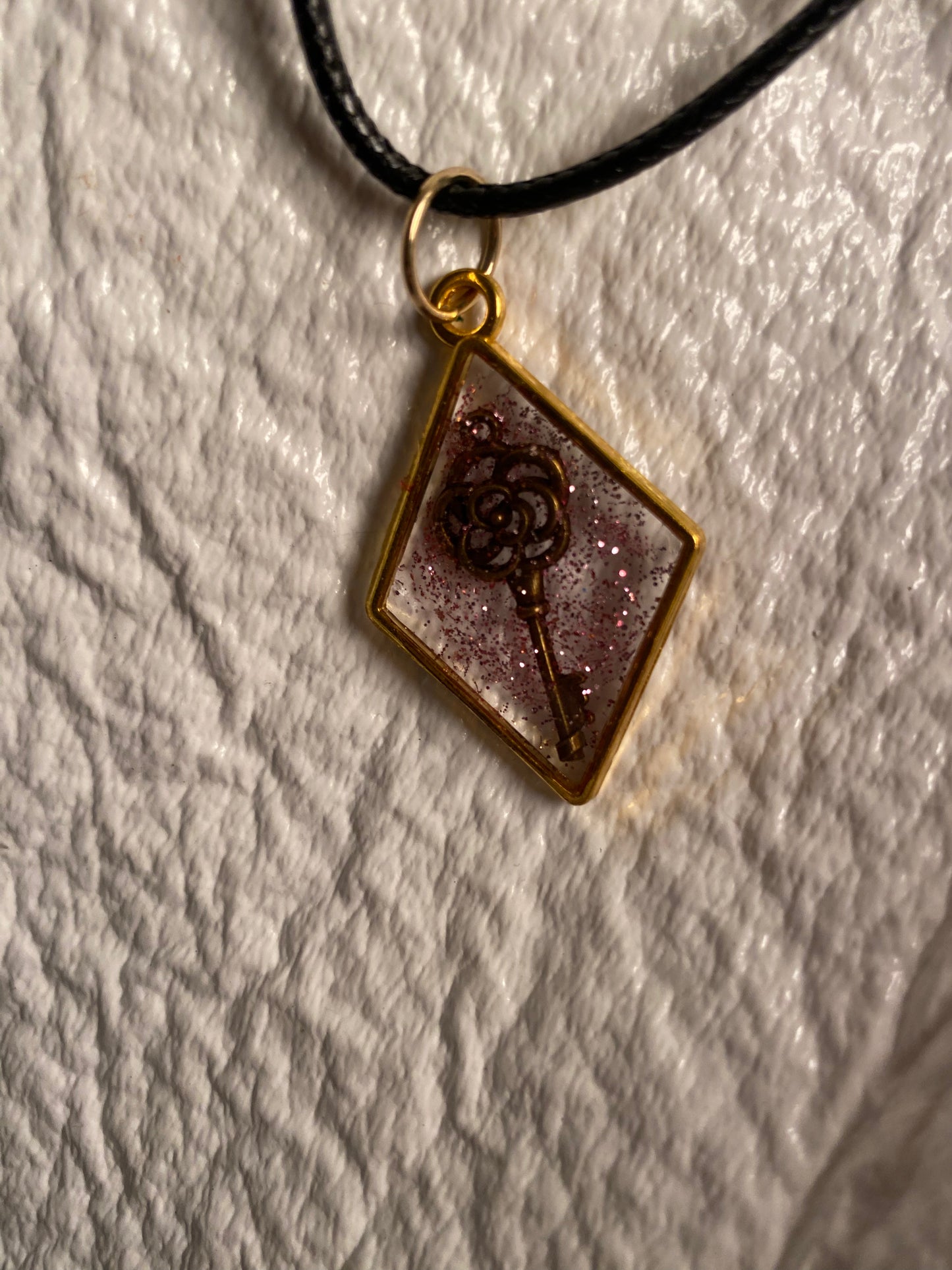 Rose key in a diamond bezel